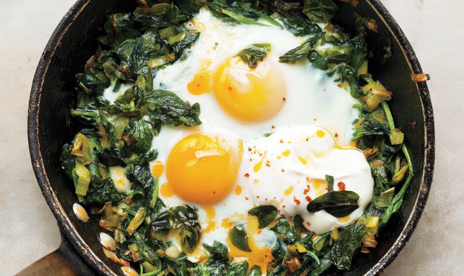 Skillet-Baked Eggs with Spinach, Yogurt, and Chili Oil